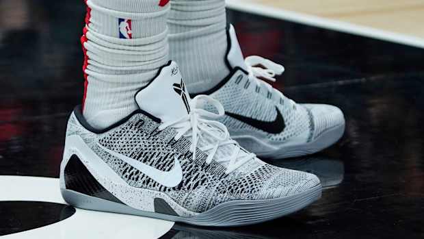 White and black Nike Kobe 9 shoes.
